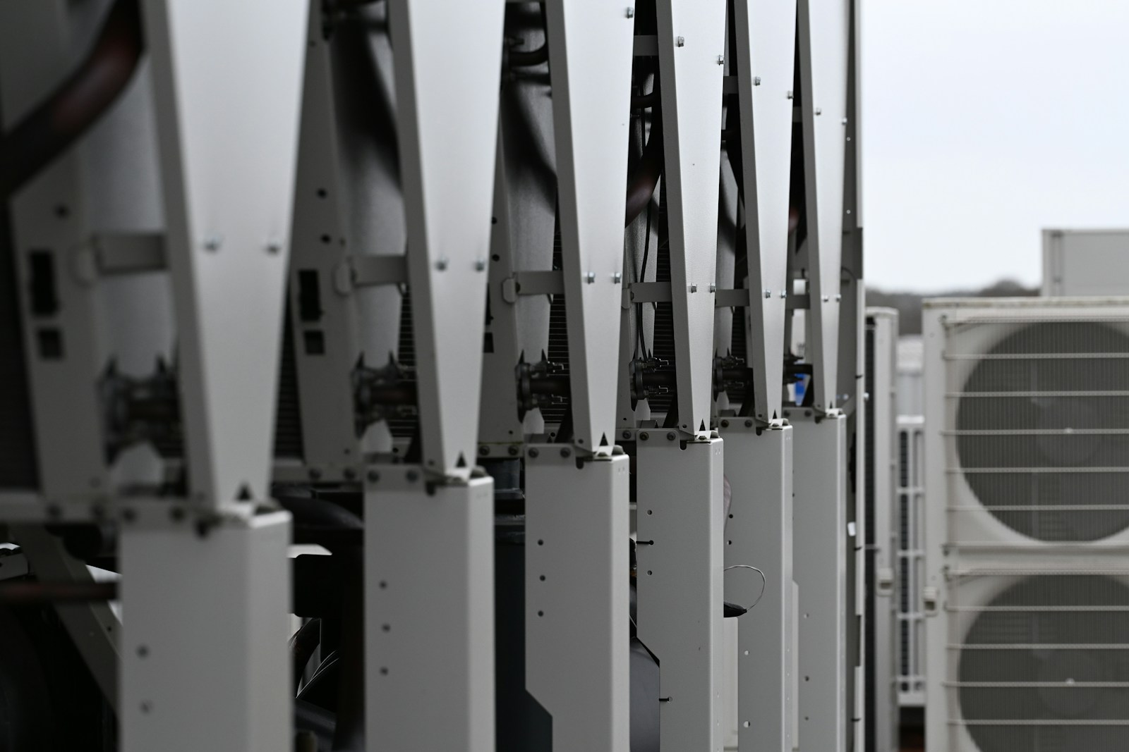 Rooftop HVAC equipment maintained in a clean row